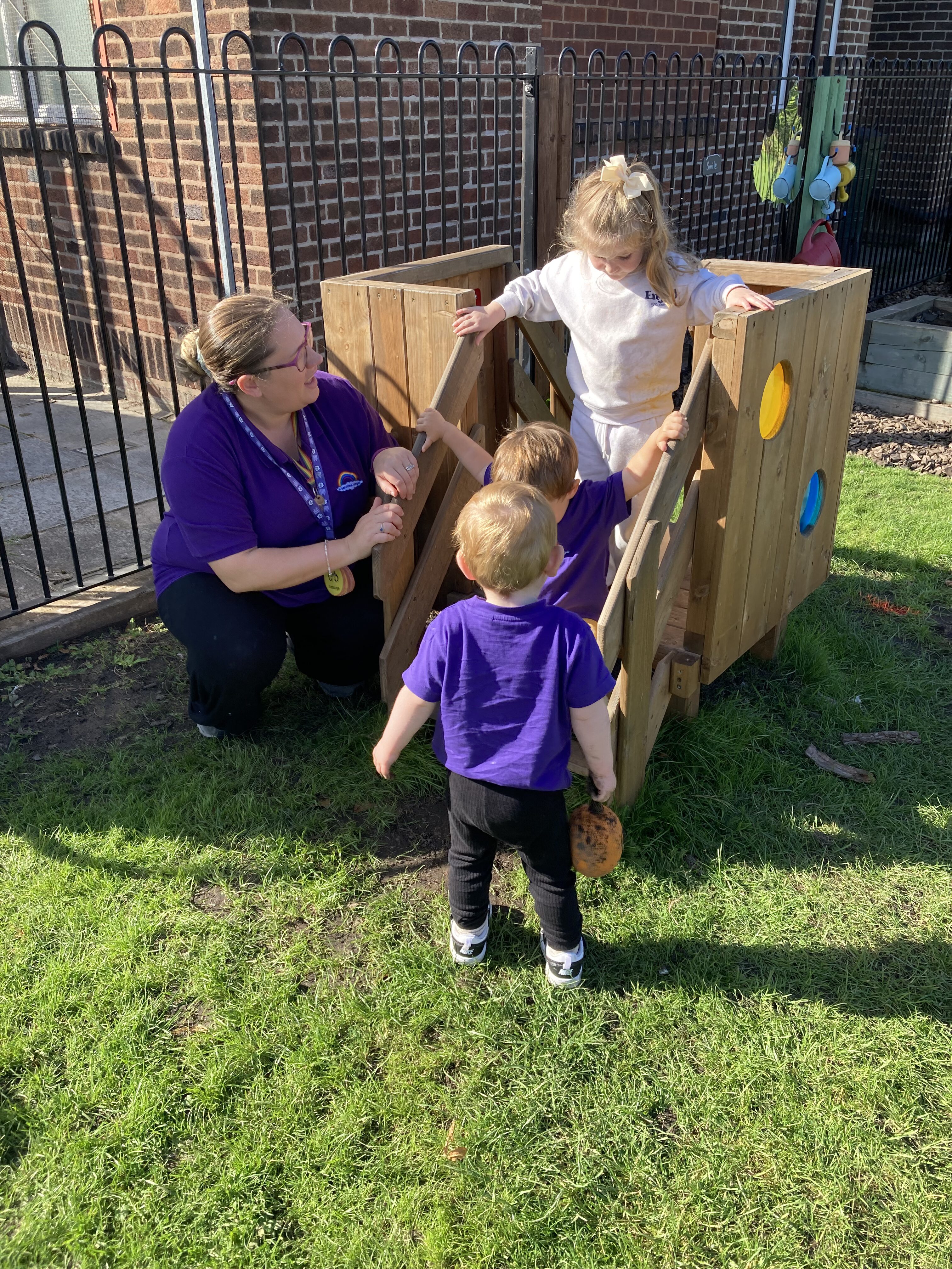 Children playing with parachute at nursery